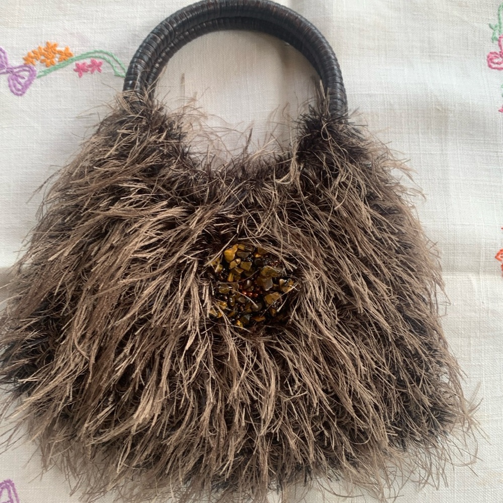 Brown, lined two handle purse, pre used.